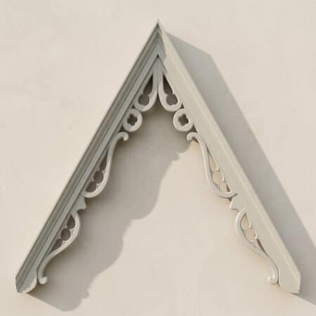 Accoya wood bargeboard with decorative scrollwork, painted finish, suitable for traditional roofline.